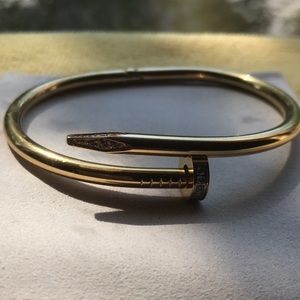 Gold tone woman’s nail bracelet